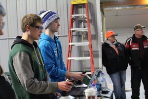 Drivers-Joe Hlucny and John Langaas showing Duane and Nancy Olsen what our robot can do.